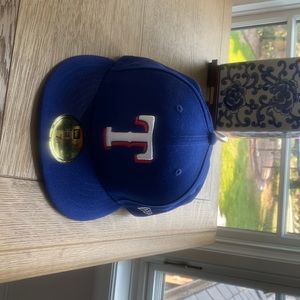 Brand new never worn texas rangers fitted hat.
